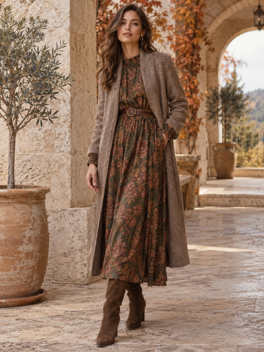 Women's Fall Capsule — layered fall dress and coat on a travertine terrace