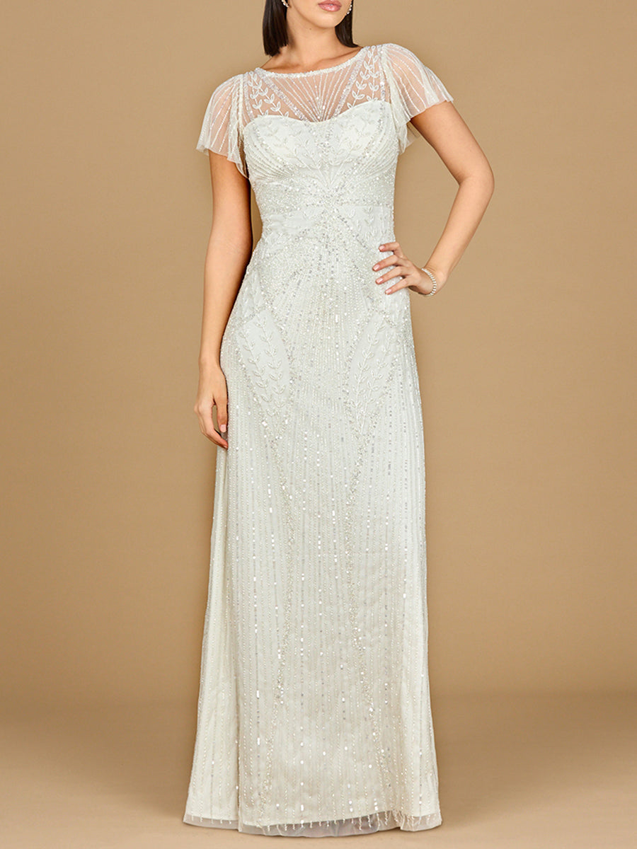 Woman wearing a long, white lace dress against a beige background